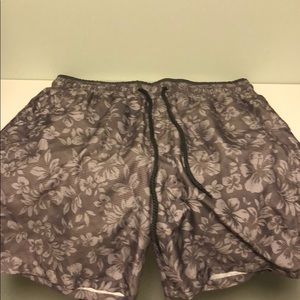 Calvin Klein Men’s floral swim trunks.